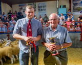Michael Aynsley presenting the Paul Aynsley memorial trophy to the champion pen from Philiphaugh Estates
